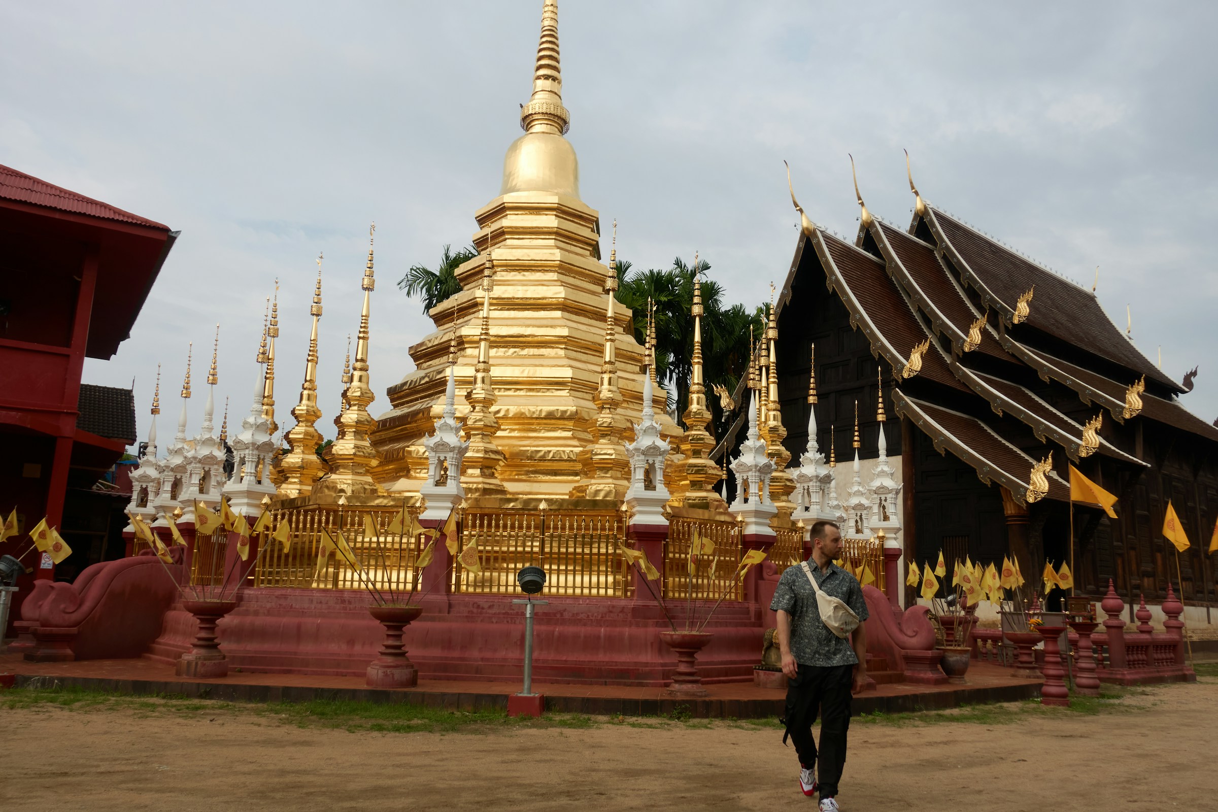 Golden temple with ornate spires and wooden building