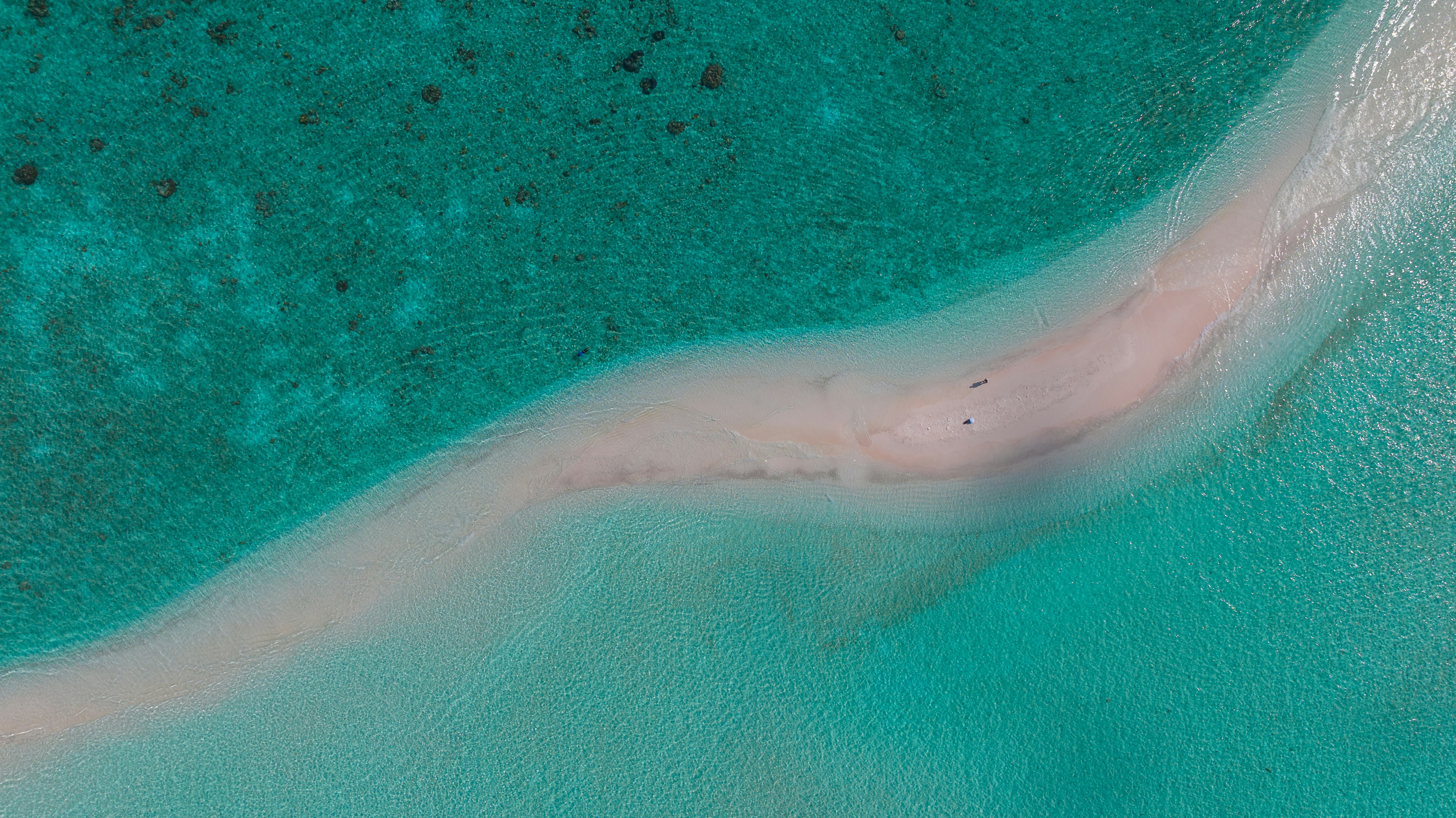 Sandbank in turquoise Maldives ocean water