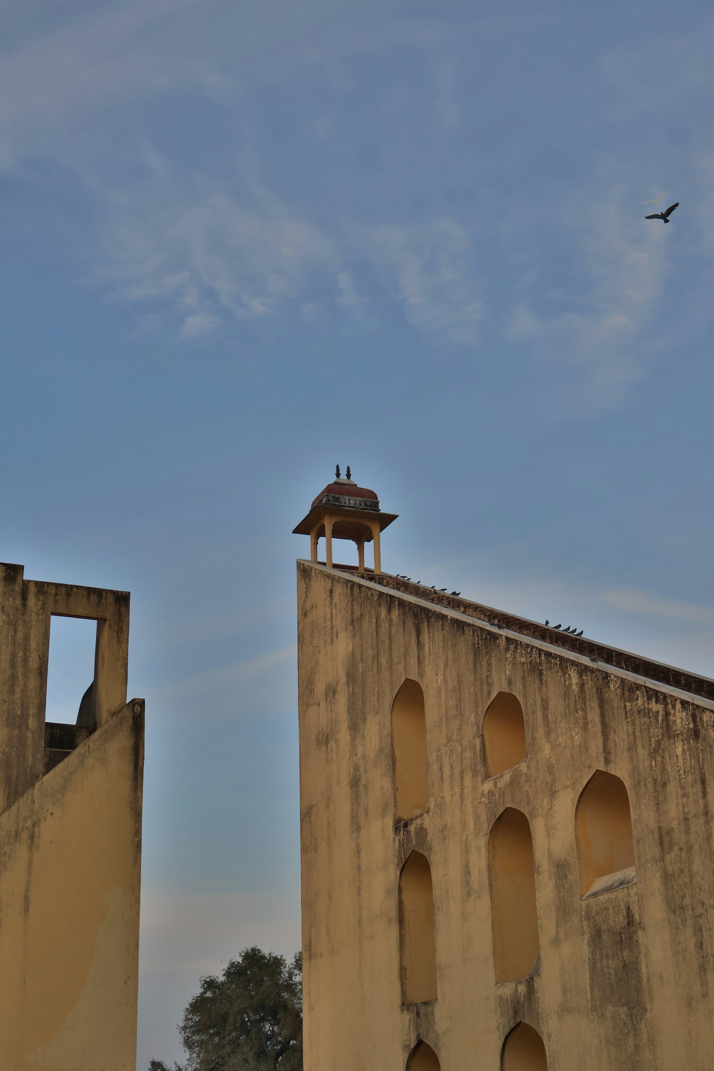 Ancient observatory structure under a clear blue sky, Jantar Mantar