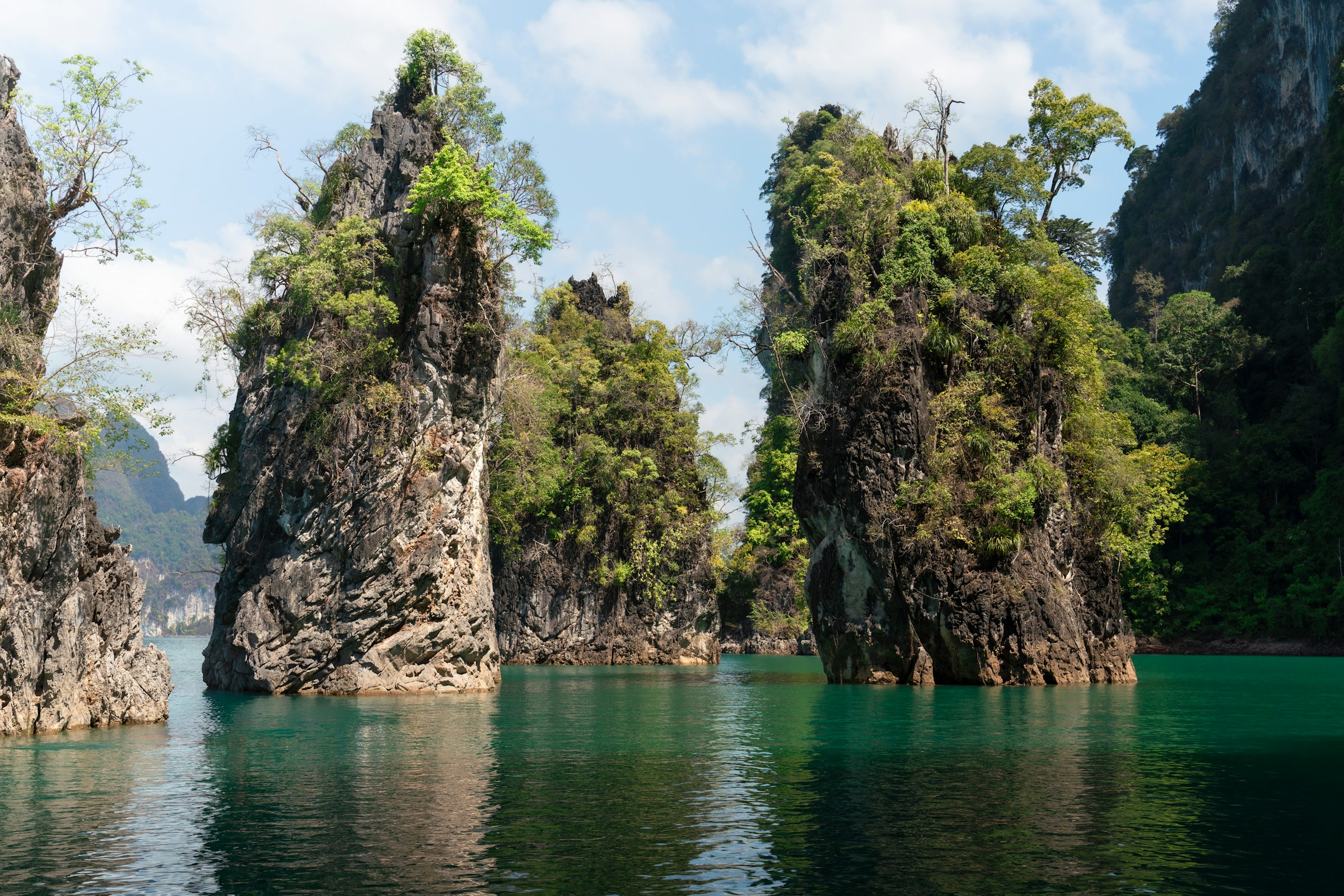 Limestone karsts rising from emerald water
