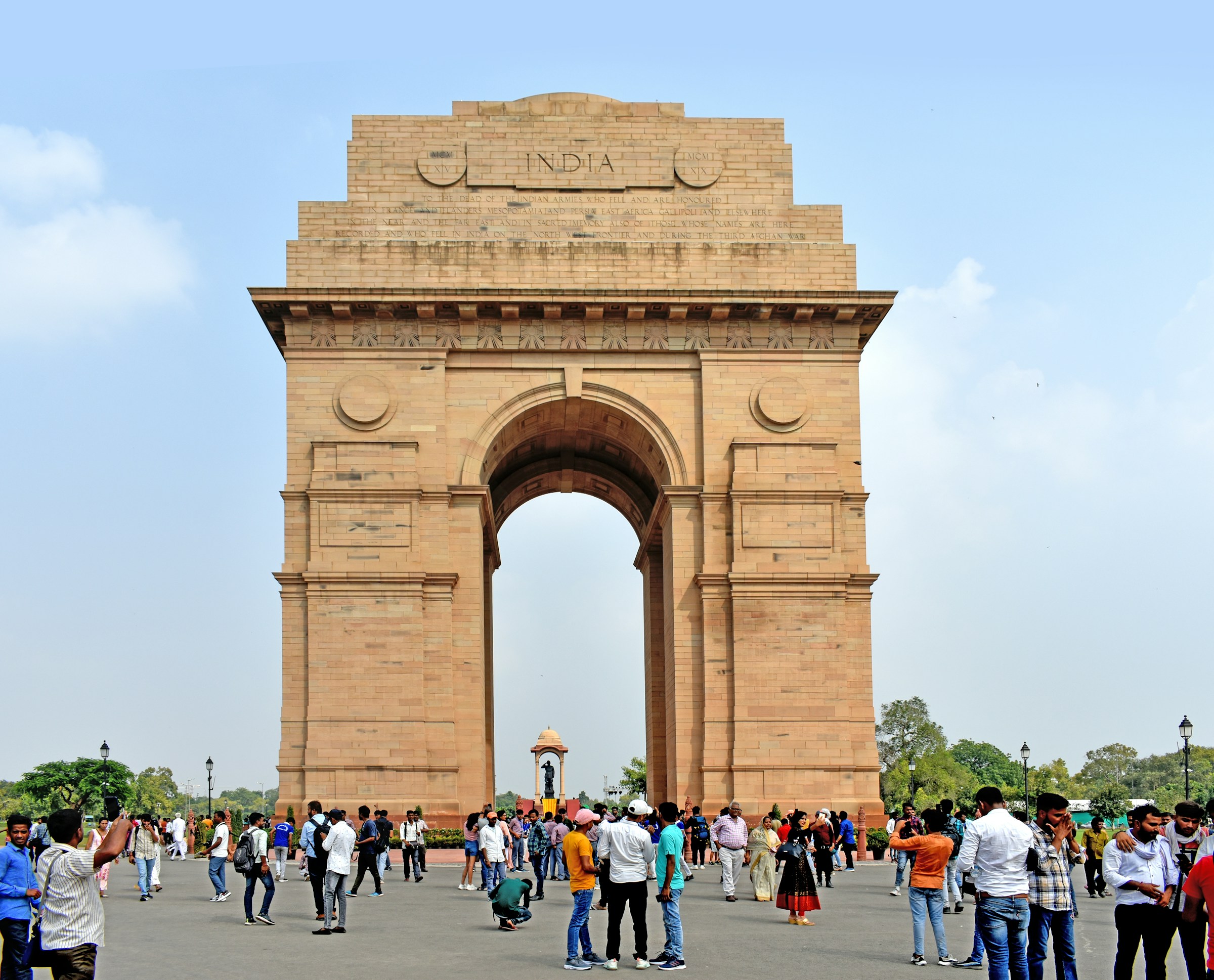 Stone arch with people walking around, India Gate