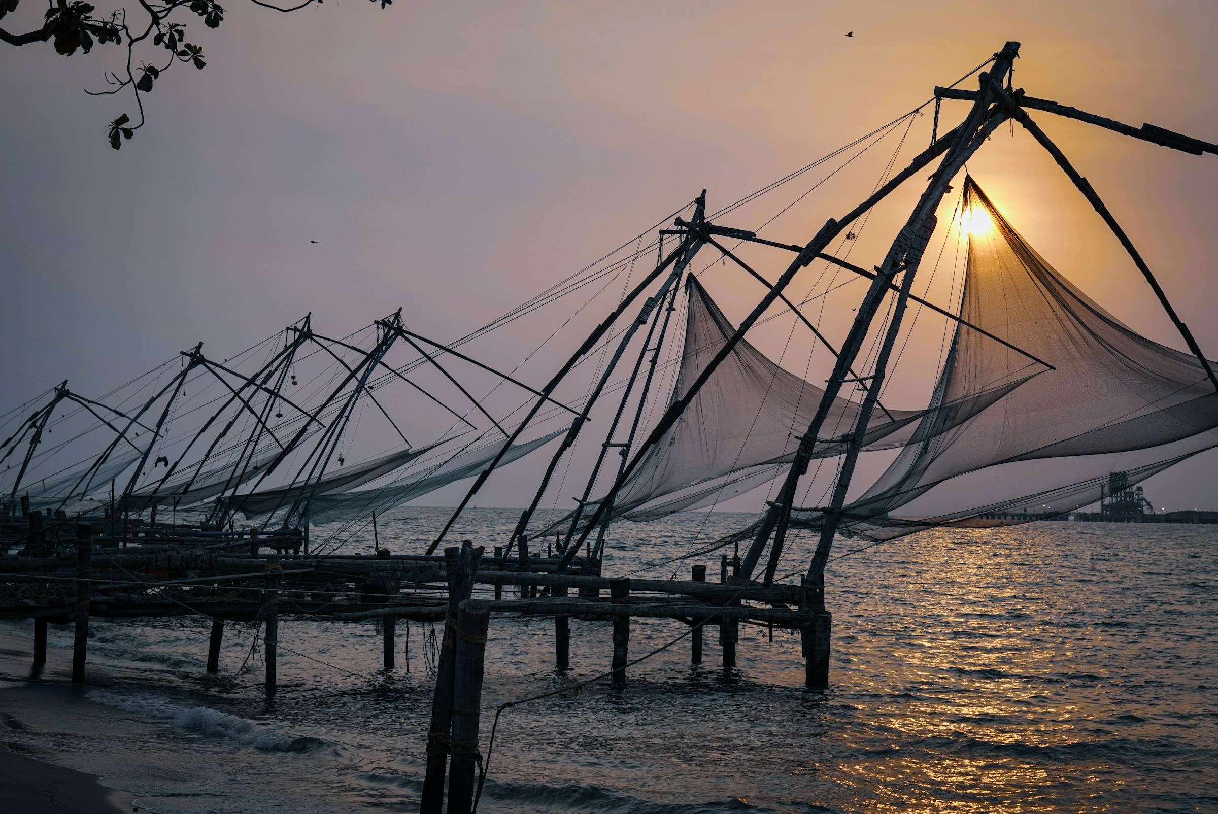 Row of traditional fishing nets on the water, Fort Kochi