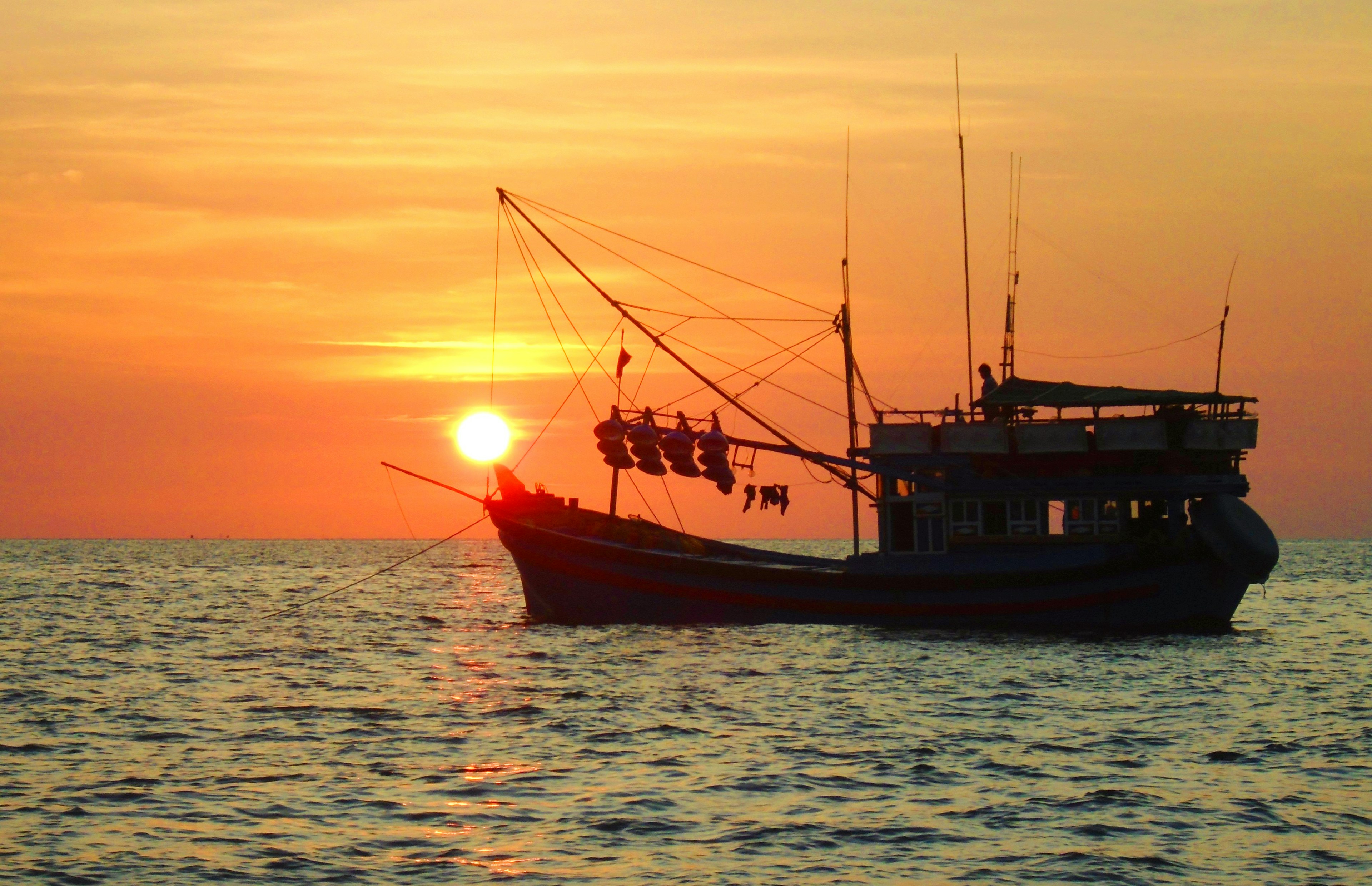Traditional fishing boat at sunset