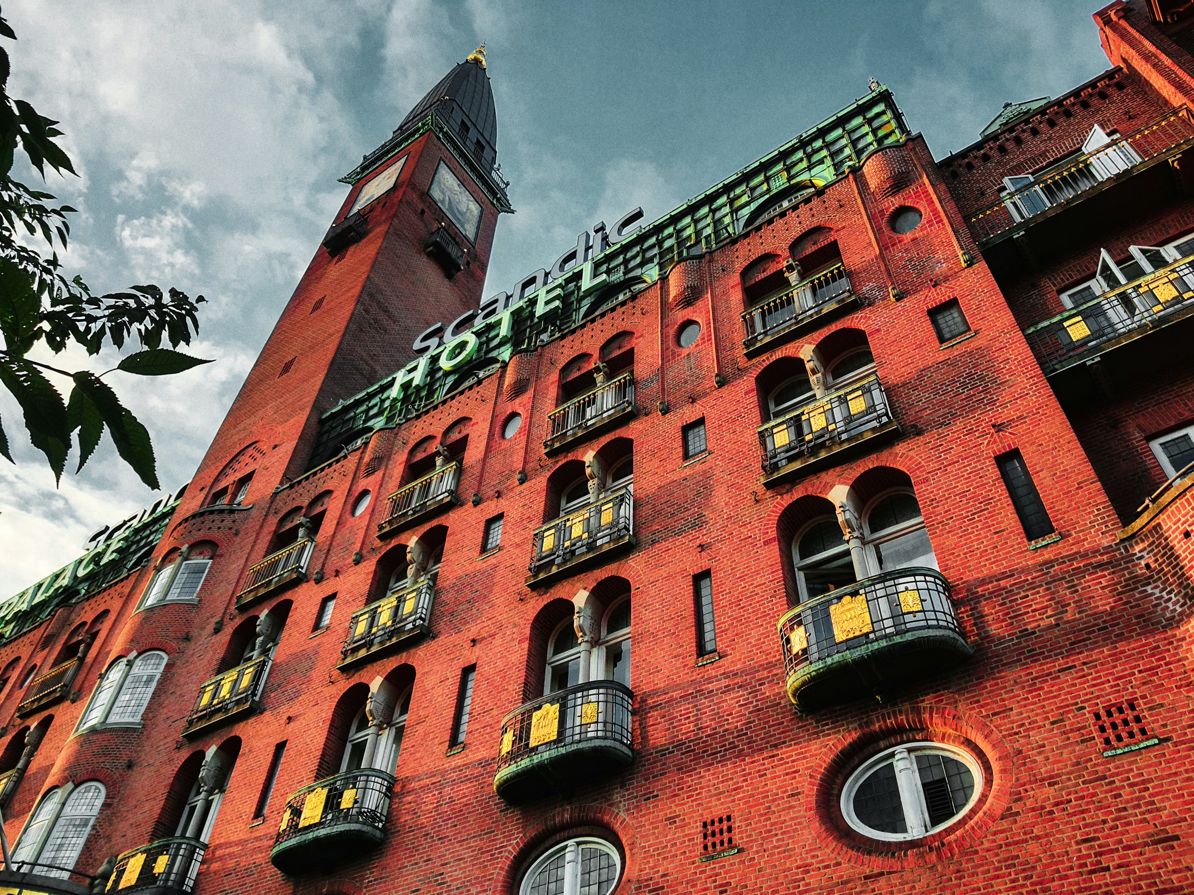 Tall red brick building with a clock tower