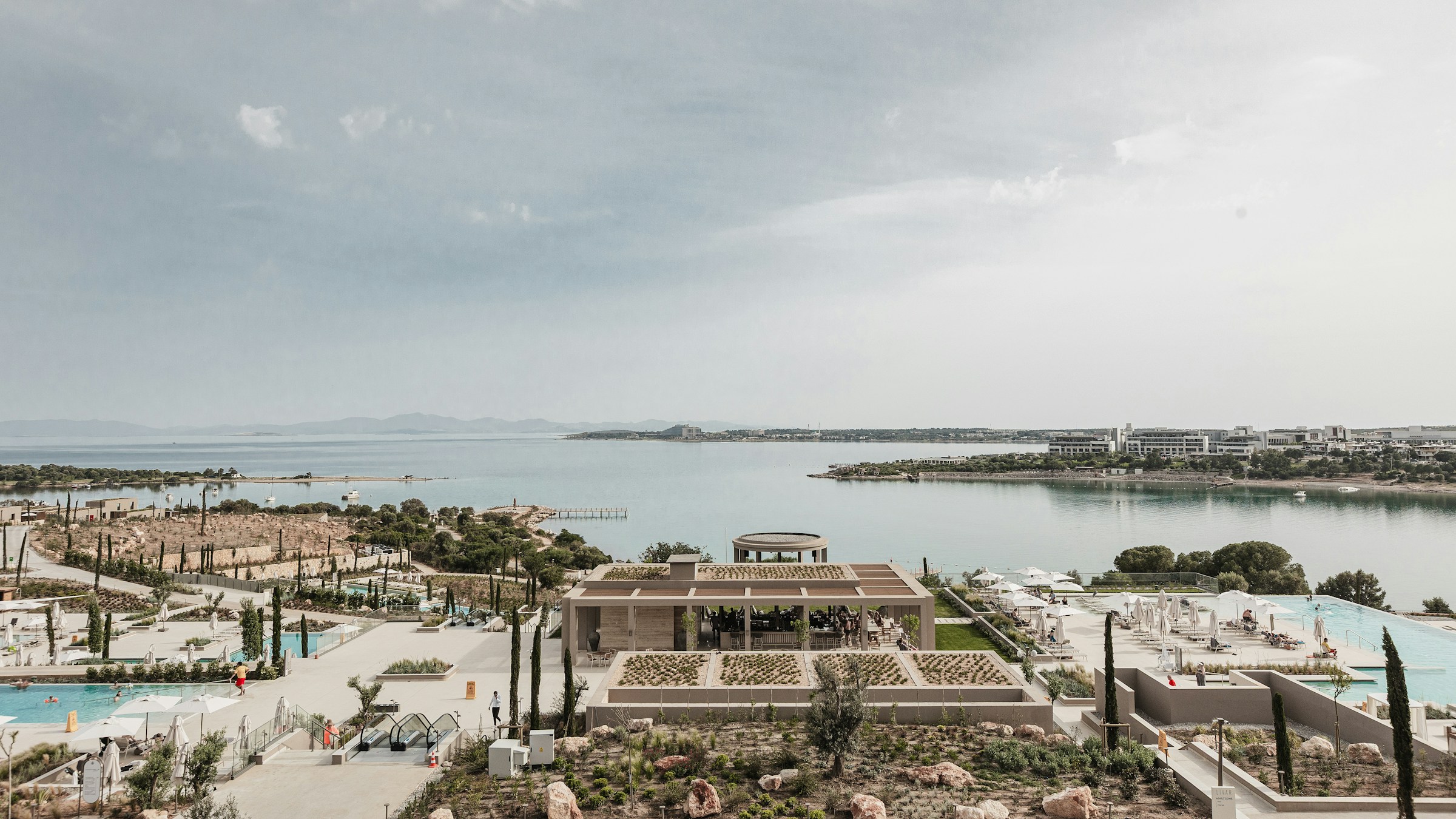 Luxury resort overlooking a serene bay with pools