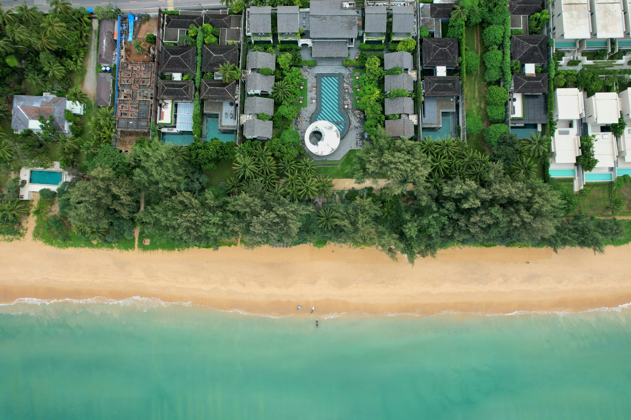 Aerial view of luxury villas by the ocean and beach
