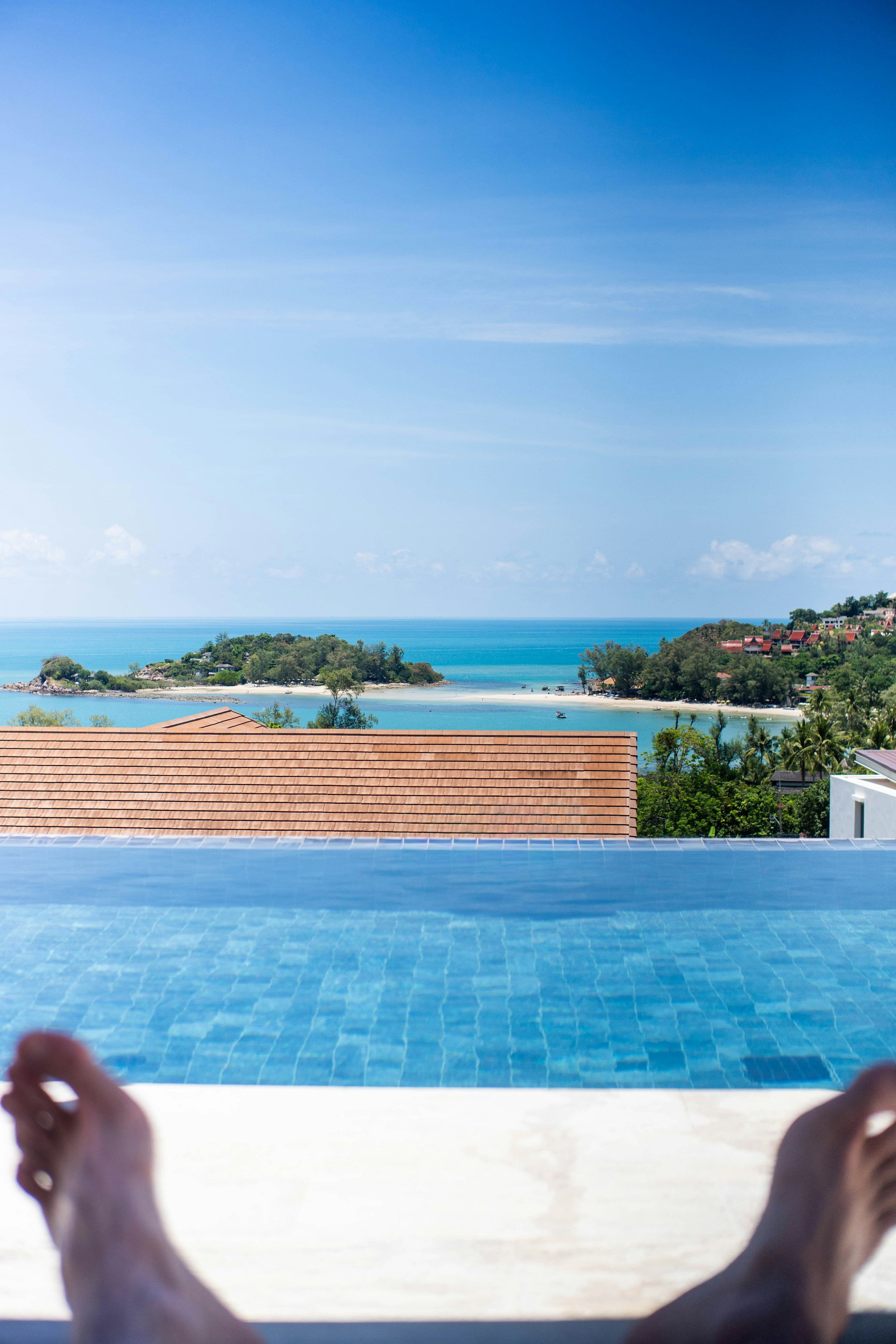Infinity pool overlooking a tropical bay