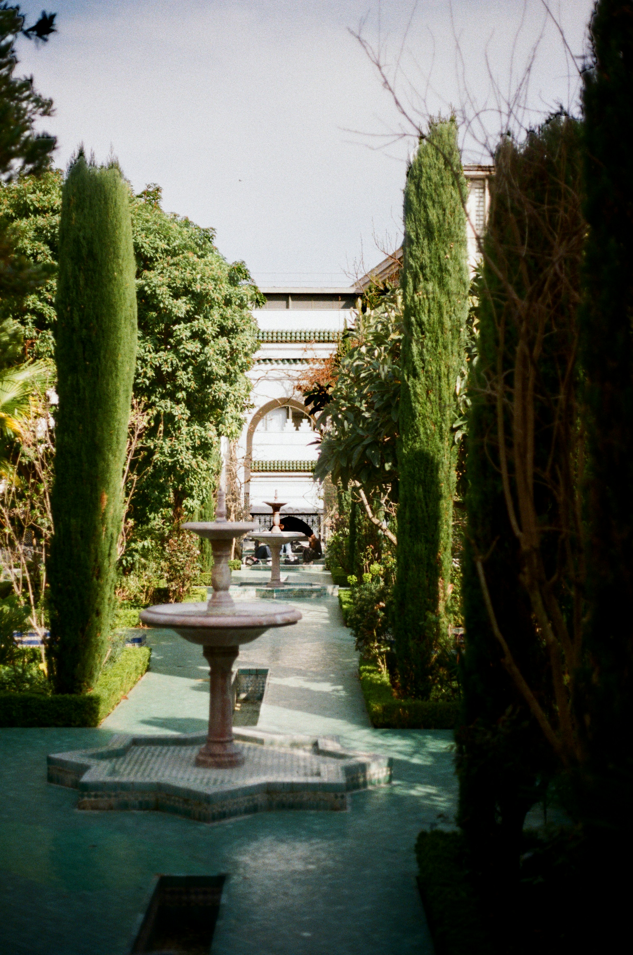 Fountain and pathway leading into a beautiful courtyard