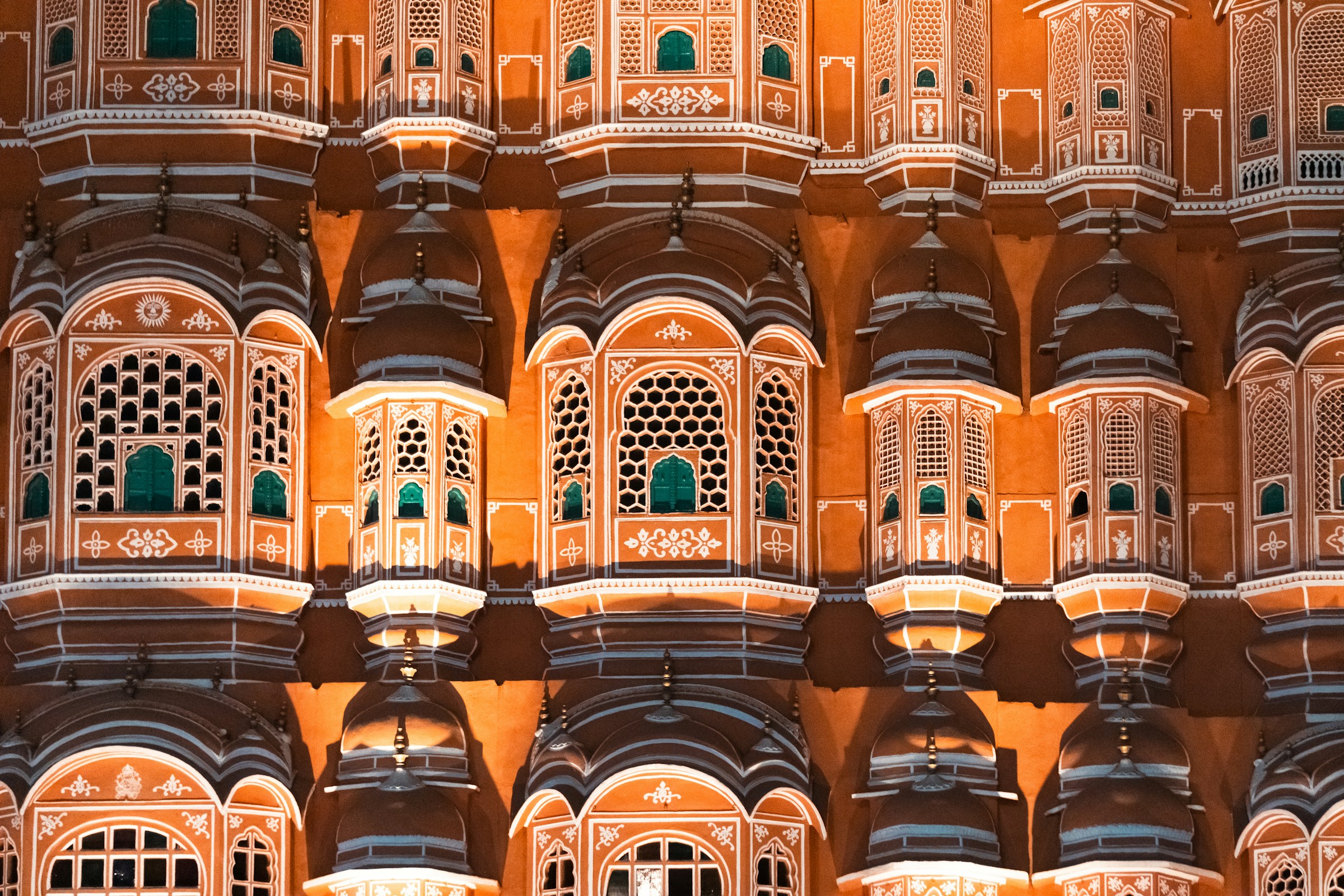 Intricate facade of an ornate Indian palace at night