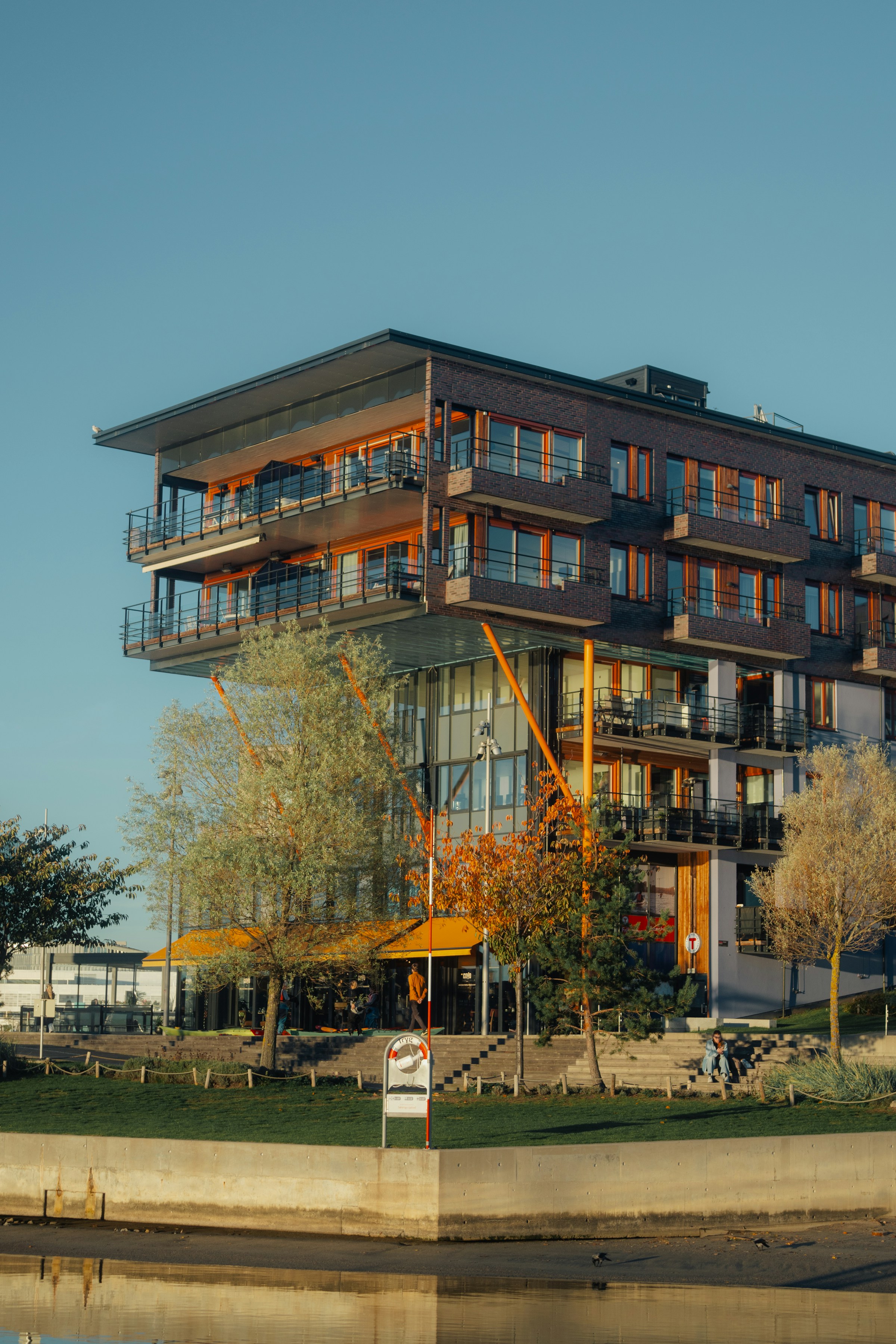Modern building with balconies overlooking water