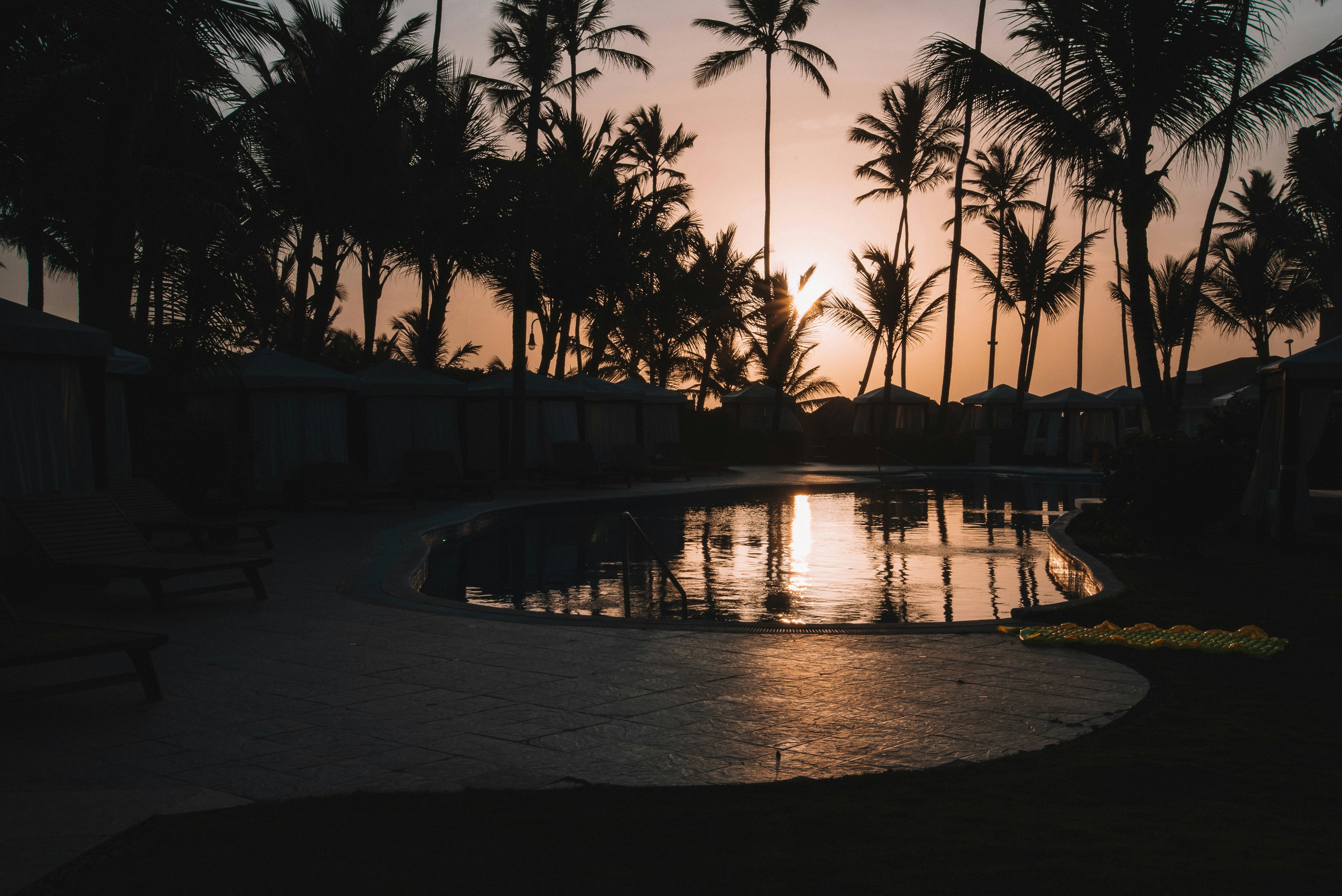 Tranquil resort pool in golden hour light